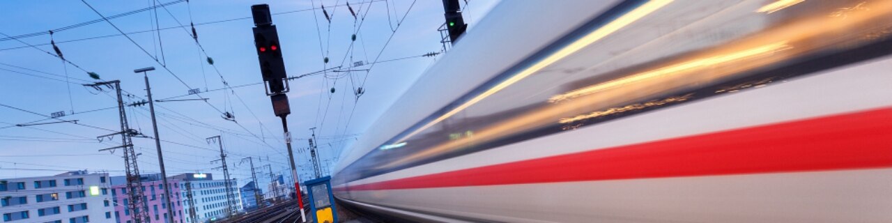 High speed passenger train on railroad track in motion