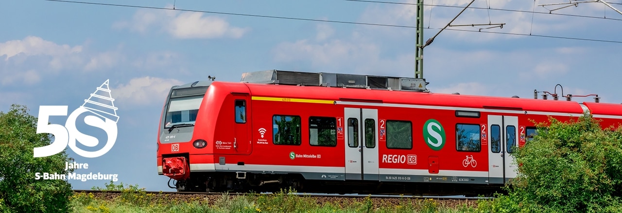 S-Bahn Magdeburg mit Signet Geburtstag in Landschaft