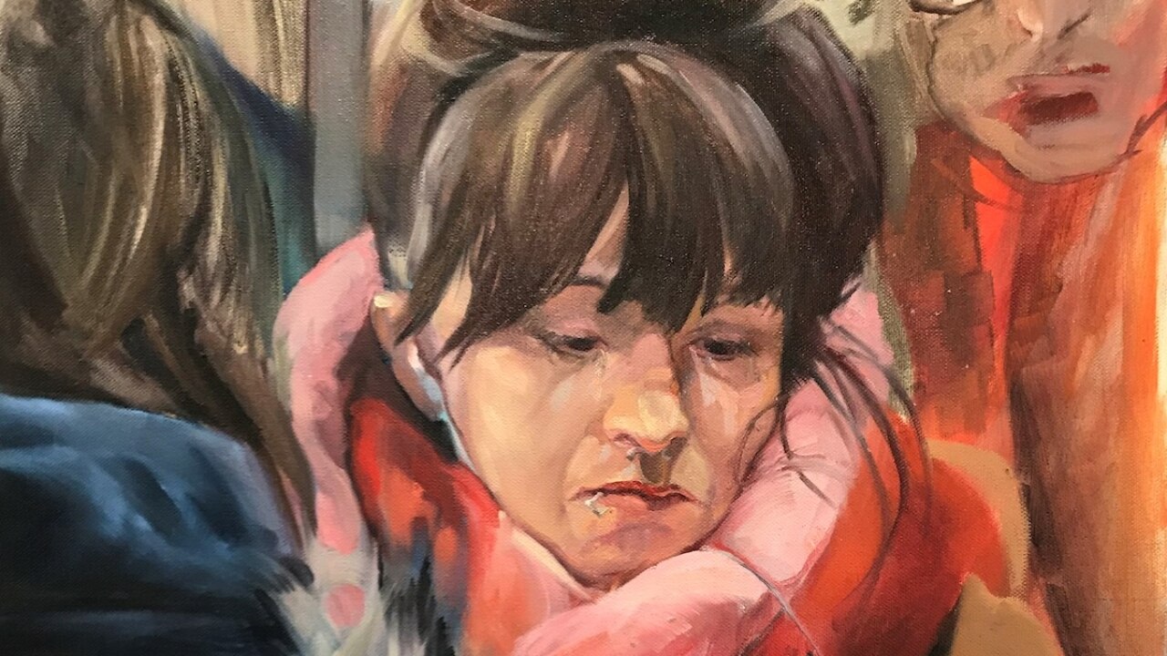 Kunstwerk von winterlich gekleideter Frau mit Smartphone in der Bahn