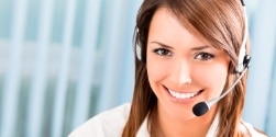 Support phone operator in headset at workplace 
