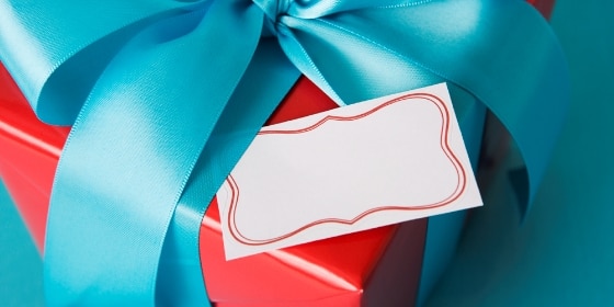 Wrapped gift box with blank tag
