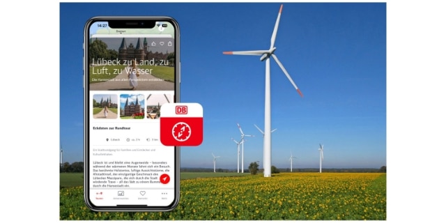 Windrad, im Vordergrund Handybild mit Ausflugs-App